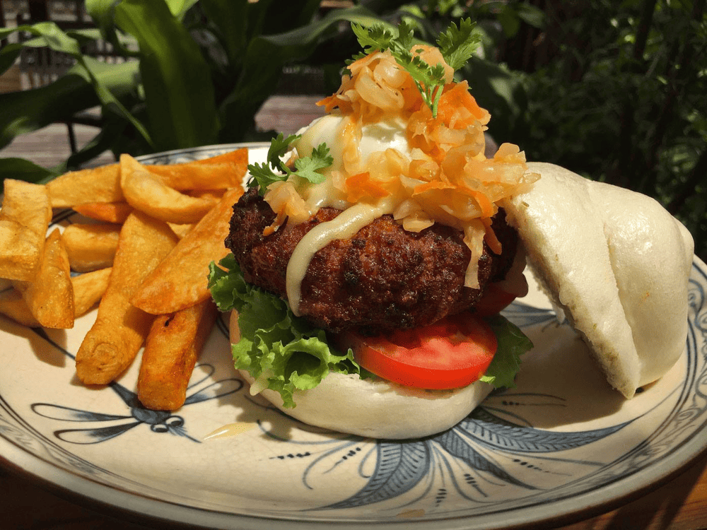 The signature Social Club Burger with perfectly grilled beef, fresh vegetables, and aioli sauce on soft brioche bread, and fries (Source: The Hanoi Social Club)